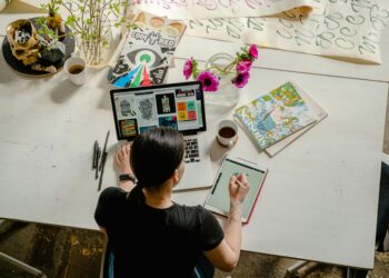 Photo by Antoni Shkraba: https://www.pexels.com/photo/photo-of-woman-writing-on-tablet-computer-while-using-laptop-4348401/