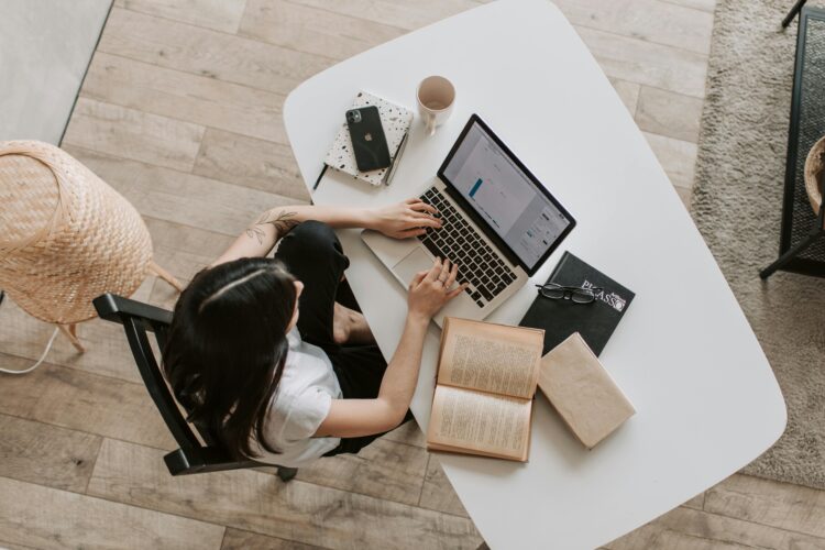 Photo by Vlada Karpovich from Pexels: https://www.pexels.com/photo/young-lady-typing-on-keyboard-of-laptop-in-living-room-4050315/