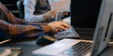 Photo by cottonbro studio: https://www.pexels.com/photo/men-sitting-at-the-desks-in-an-office-and-using-computers-6803551/