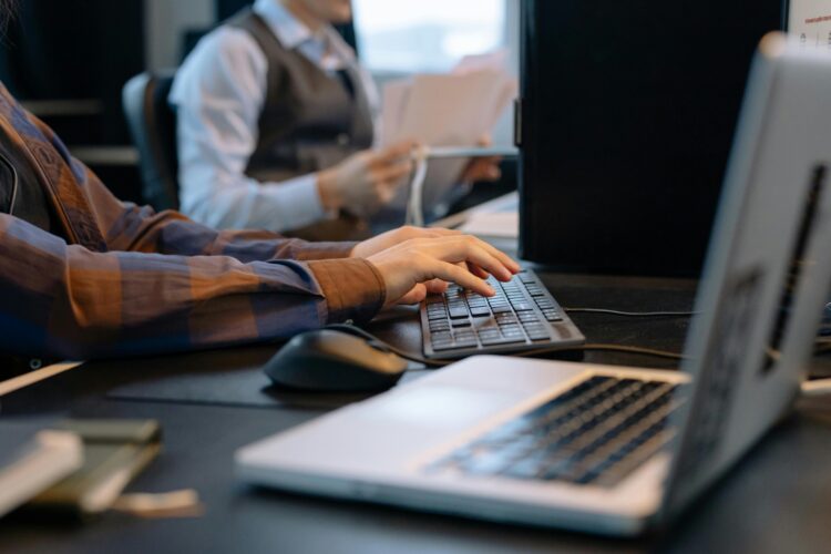 Photo by cottonbro studio: https://www.pexels.com/photo/men-sitting-at-the-desks-in-an-office-and-using-computers-6803551/