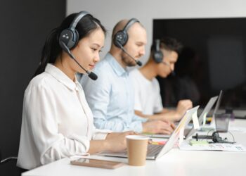 Photo by Mikhail Nilov: https://www.pexels.com/photo/shallow-focus-of-woman-working-in-a-call-center-7682340/