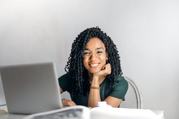 Photo by Andrea Piacquadio: https://www.pexels.com/photo/happy-ethnic-woman-sitting-at-table-with-laptop-3769021/