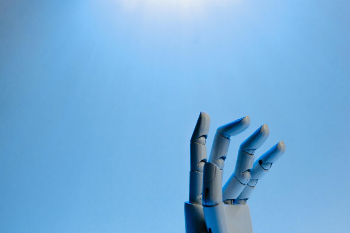 Photo by Tara Winstead: https://www.pexels.com/photo/robot-fingers-on-blue-background-8386369/