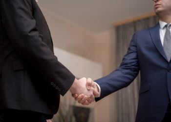 Photo by George Morina: https://www.pexels.com/photo/men-in-black-and-blue-suit-jacket-doing-handshake-6918507/