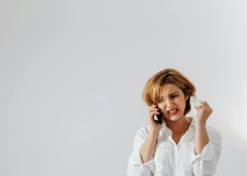 Photo by Photo By: Kaboompics.com: https://www.pexels.com/photo/a-woman-in-white-long-sleeve-shirt-looking-angry-while-having-a-phone-call-6028583/