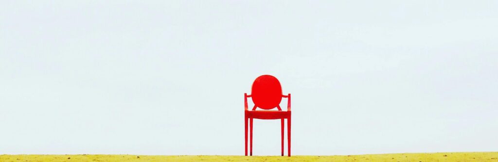 Photo by Waldemar Nowak: https://www.pexels.com/photo/red-armchair-on-brown-surface-910625/