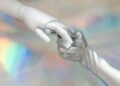 Photo by Tara Winstead: https://www.pexels.com/photo/hand-with-silver-glove-holding-a-robot-hand-8849283/