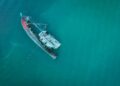 Photo by Pok Rie: https://www.pexels.com/photo/sunken-boat-on-blue-sea-10189195/
