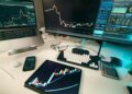 Photo by Jakub Zerdzicki: https://www.pexels.com/photo/trading-desk-with-financial-charts-and-technology-31650949/