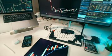 Photo by Jakub Zerdzicki: https://www.pexels.com/photo/trading-desk-with-financial-charts-and-technology-31650949/
