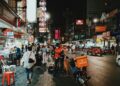 Photo by Tony Wu from Pexels: https://www.pexels.com/photo/people-walking-on-flea-market-during-nighttime-10532275/