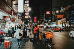 Photo by Tony Wu from Pexels: https://www.pexels.com/photo/people-walking-on-flea-market-during-nighttime-10532275/