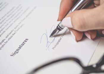 Photo by energepic.com: https://www.pexels.com/photo/person-holding-silver-pen-signing-photographers-signature-175045/