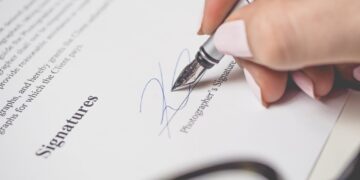 Photo by energepic.com: https://www.pexels.com/photo/person-holding-silver-pen-signing-photographers-signature-175045/