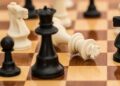 Photo by Pixabay: https://www.pexels.com/photo/black-white-and-brown-chess-board-game-139392/