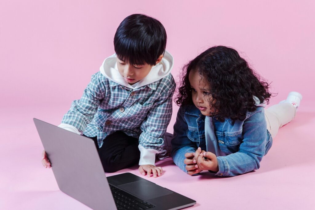 Photo by Amina Filkins: https://www.pexels.com/photo/multiethnic-kids-watching-computer-in-studio-5560076/