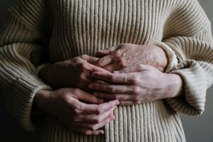 Photo by cottonbro studio: https://www.pexels.com/photo/a-person-hugging-another-person-wearing-knitted-sweater-5493794/