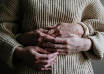 Photo by cottonbro studio: https://www.pexels.com/photo/a-person-hugging-another-person-wearing-knitted-sweater-5493794/