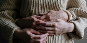 Photo by cottonbro studio: https://www.pexels.com/photo/a-person-hugging-another-person-wearing-knitted-sweater-5493794/
