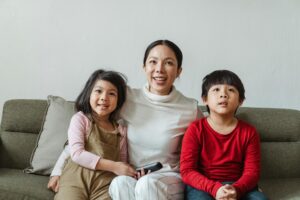 Photo by Ketut Subiyanto: https://www.pexels.com/photo/happy-ethnic-mother-with-little-children-watching-tv-on-sofa-4474009/