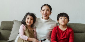 Photo by Ketut Subiyanto: https://www.pexels.com/photo/happy-ethnic-mother-with-little-children-watching-tv-on-sofa-4474009/