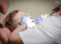 Photo by Pixabay: https://www.pexels.com/photo/dentist-woman-wearing-white-gloves-and-white-scrubsuit-checking-boy-s-teeth-52527/