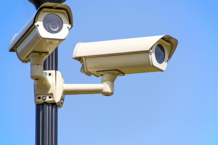 Photo by AS Photography: https://www.pexels.com/photo/white-2-cctv-camera-mounted-on-black-post-under-clear-blue-sky-96612/