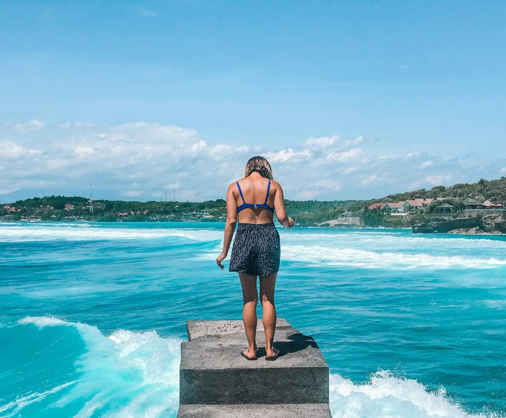 Photo by Tiff Ng from Pexels: https://www.pexels.com/photo/woman-standing-on-dock-2097613/
