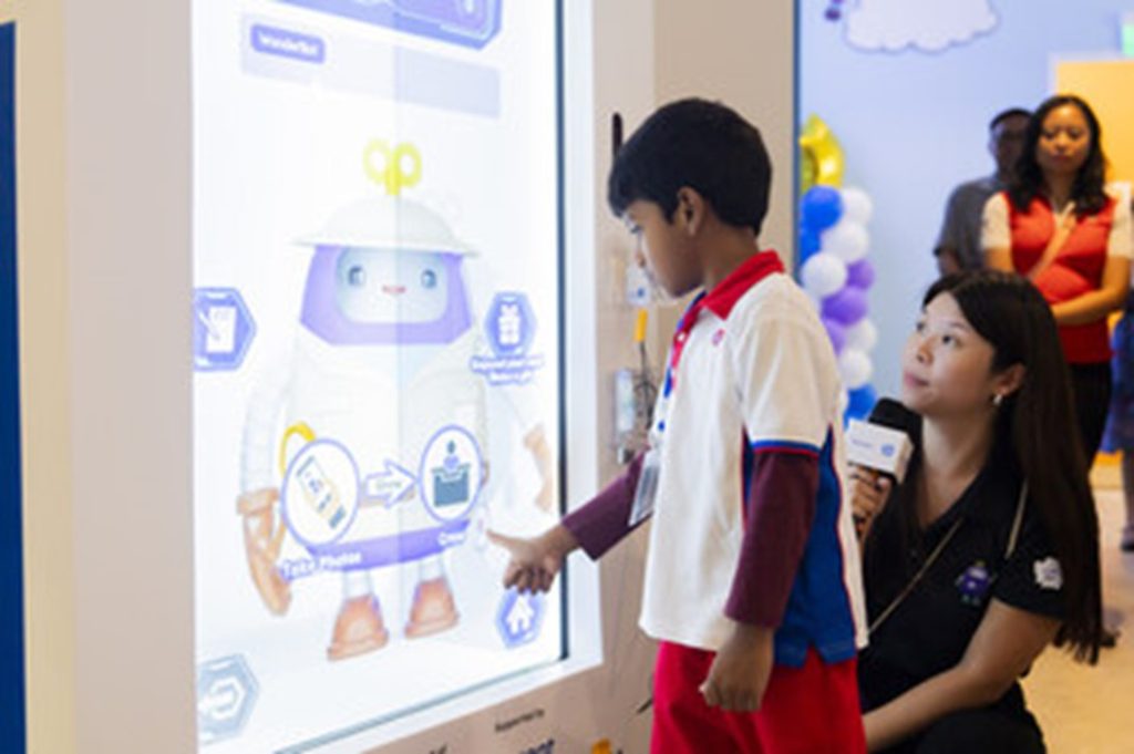 PHOTO PCF Sparkletots Preschool student interacting with WonderBot 2.0 at the Children's Museum Singapore