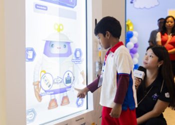 PHOTO PCF Sparkletots Preschool student interacting with WonderBot 2.0 at the Children's Museum Singapore