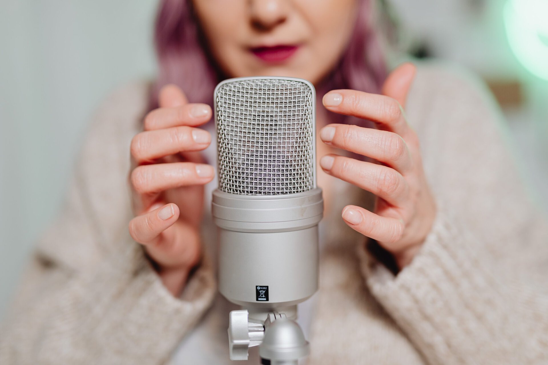 Photo by www.kaboompics.com: https://www.pexels.com/photo/a-woman-touching-a-microphone-6920067/