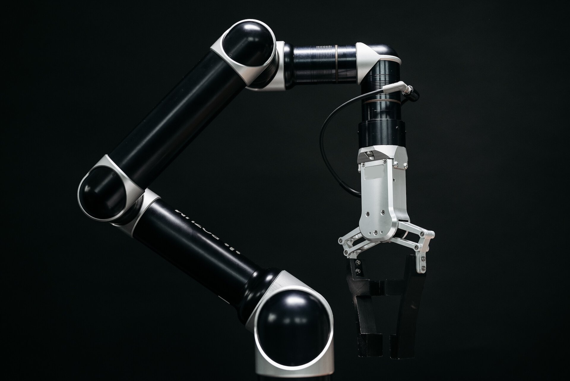 Photo by Pavel Danilyuk: https://www.pexels.com/photo/robot-on-a-black-background-8438865/