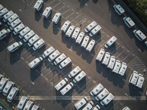 Photo by Kindel Media: https://www.pexels.com/photo/top-view-shot-of-vehicles-on-an-open-parking-lot-9716240/