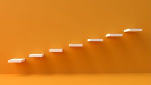 Photo by Kanhaiya Sharma: https://www.pexels.com/photo/while-ladder-attached-to-the-orange-wall-13062567/