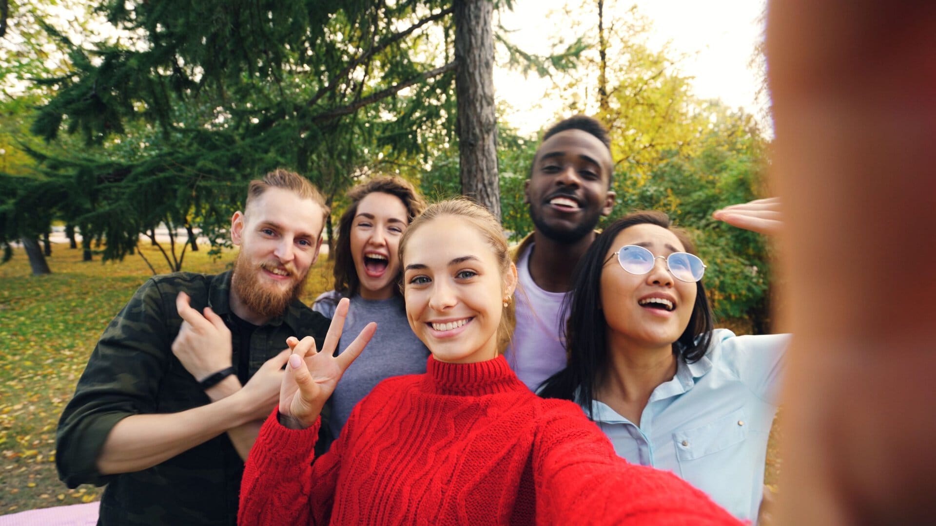 Photo by Vitaly Gariev: https://www.pexels.com/photo/diverse-group-of-friends-taking-a-selfie-outdoors-36713401/